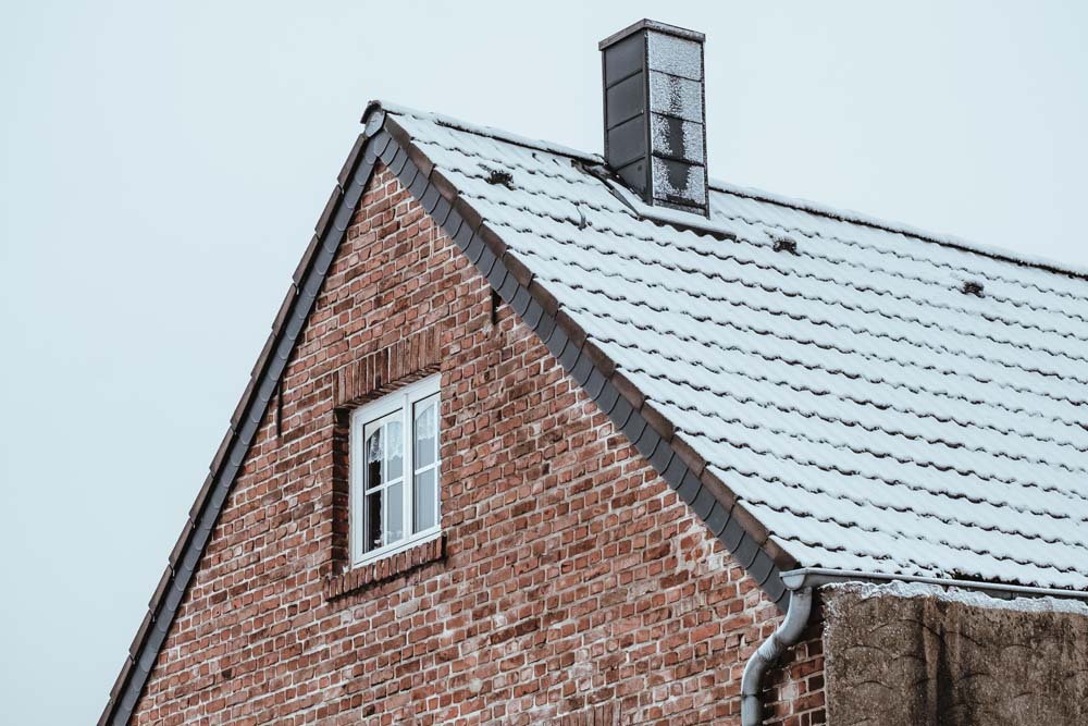 Roof of a house covered by snow