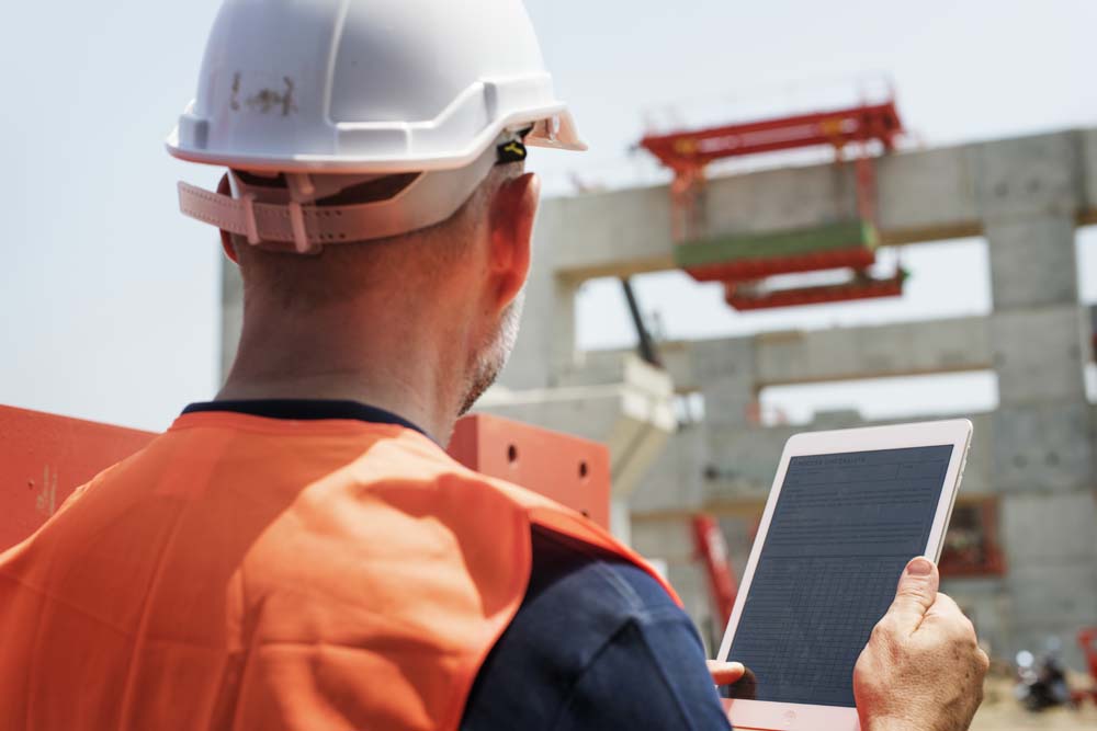 construction worker working outdoors with project